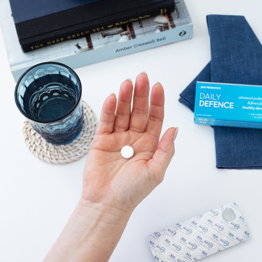 An image of a hand holding Blis Probiotics