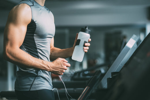 A muscular man working out in a gym